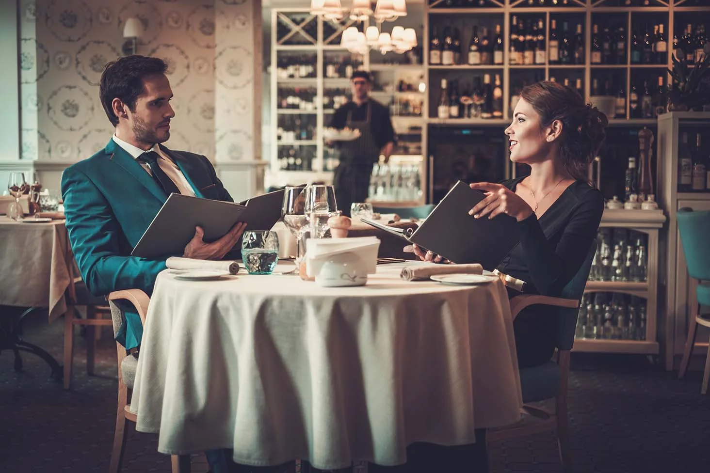 How important is a menu? image of a couple reading a menu in a restaurant